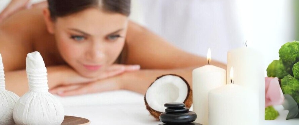 Beautiful young woman getting spa massage in fiveelementsspa.com