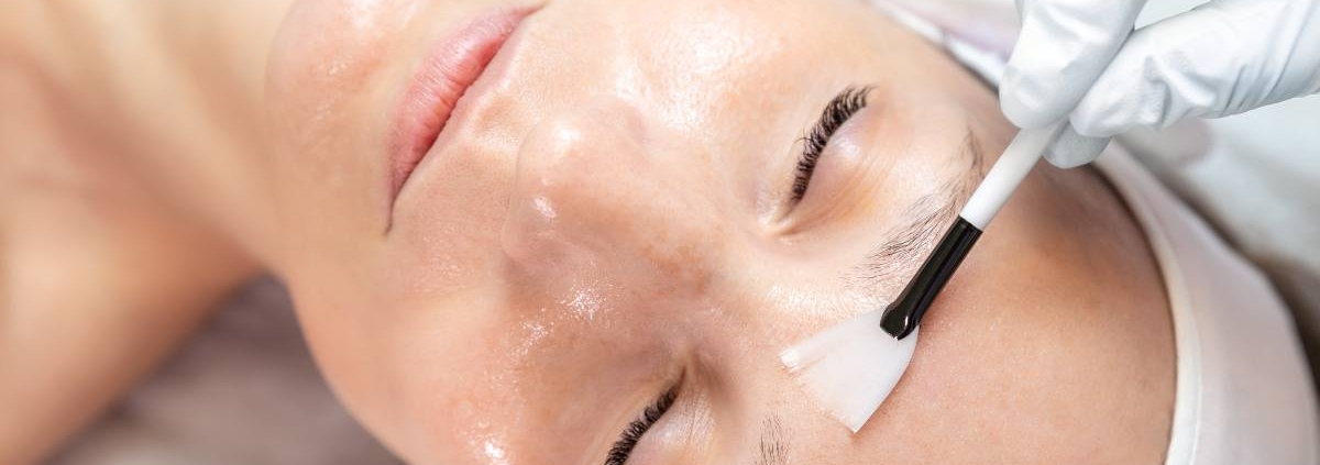 A close-up of a woman receiving a professional collagen treatment at a beauty salon.