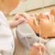 Medical professional injecting a client’s forehead during a facial rejuvenation procedure.
