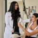 Nurse practitioner consulting with a client in the treatment room at Five Elements Medical Spa, Deerfield Beach